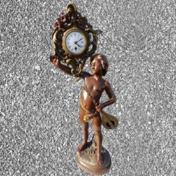 Figural Mantel Timepiece - glass, enamel - 1920