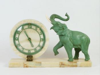Figural Mantel Timepiece - patinated metal, brass - 1930